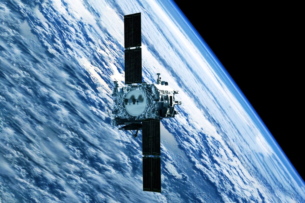 Satellite above Earth. CREDIT: ﻿Shutterstock.com/Artsiom P.