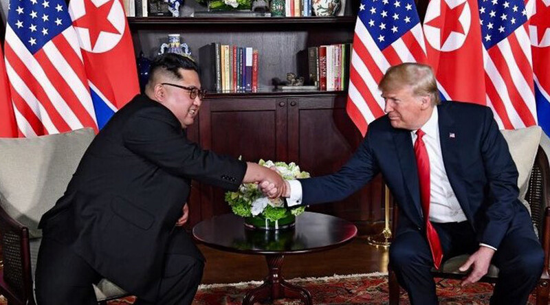 DPRK–USA Singapore Summit,  June 12, 2018. CREDIT: <a href="https://commons.wikimedia.org/wiki/File:Trump_and_Kim_shaking_hands_in_the_summit_room.jpg">Dan Scavino Jr.</a> via Wikipedia, Public Domain