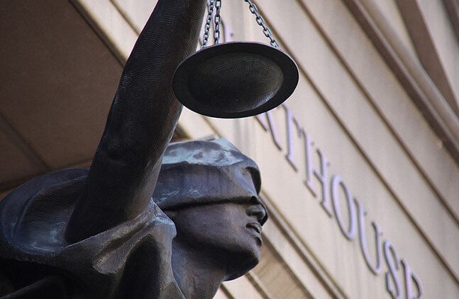 Statue of Blind Justice, Albert V. Bryan Federal District Courthouse, Alexandria, VA. CREDIT: <a href="http://www.flickr.com/photos/23165290@N00/6830726742">Tim Evanson</a> <a href="http://creativecommons.org/licenses/by-sa/2.0/deed.en">(CC)</a>