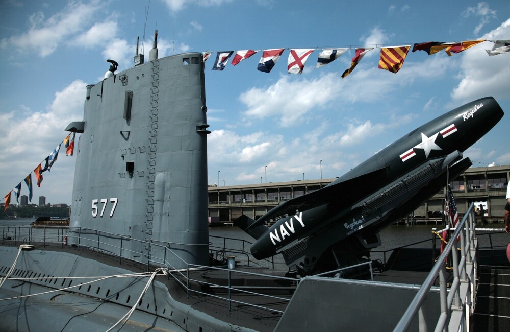 USS Growler, a Grayback-class submarine USS. Tied up next to USS Intrepid in New York in August 2006. A Regulus I surface to surface nuclear missile raised in a launch position.