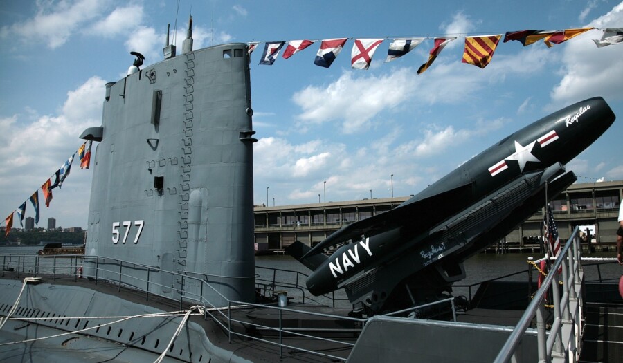 USS Growler, a Grayback-class submarine USS. Tied up next to USS Intrepid in New York in August 2006. A Regulus I surface to surface nuclear missile raised in a launch position.
